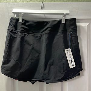 Never worn, tags still on! Women’s black athletic skort- Rhoback size large